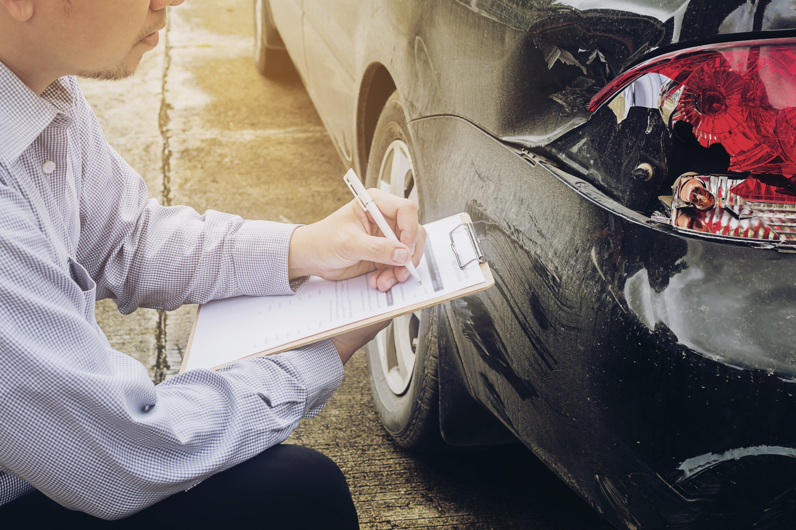 insurance adjuster reviewing damage